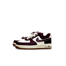 Maroon and white sneakers with a visible Nike logo