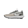 Gray and white sneaker with Nike logo